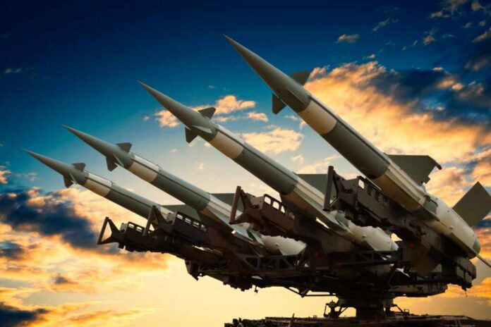 Cruise Missile launcher_2126248766.jpg Cruise missile launcher with missiles pointed upwards against a sunset sky