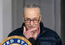 Schumer’s Control SHAKEN: Primary Challenges Loom Man speaking at a podium with a thoughtful expression