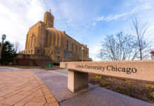 Sign for Loyola University Chicago with a building in the background