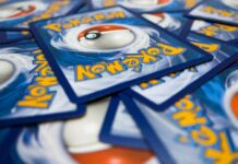 A pile of Pokémon trading cards featuring a Poké Ball design
