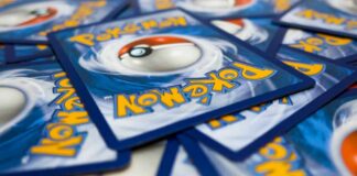 A pile of Pokémon trading cards featuring a Poké Ball design
