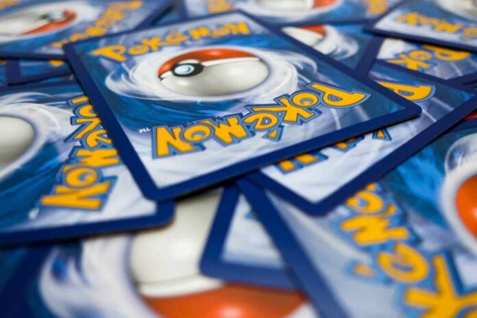 A pile of Pokémon trading cards featuring a Poké Ball design