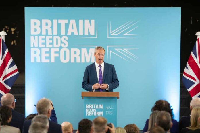 A politician delivering a speech at a podium with British flags in the background
