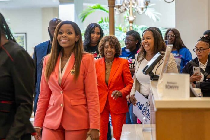 A diverse group of people smiling and walking together at an event