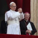 Pope giving a blessing from a balcony