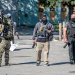 Law enforcement officers in tactical gear during an operation