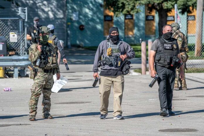 Law enforcement officers in tactical gear during an operation