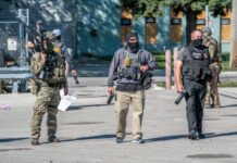 Law enforcement officers in tactical gear during an operation