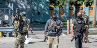 Law enforcement officers in tactical gear during an operation