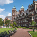 A university campus featuring historic buildings and green lawns
