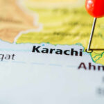 Close-up of a map showing Karachi with a red location pin