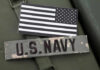 US Navy patch and black and white flag