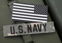 US Navy patch and black and white flag