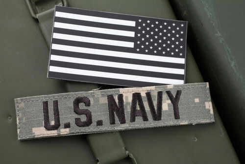 US Navy patch and black and white flag