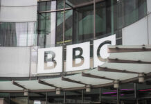 BBC’s Stunning Firing: What Are They Hiding? BBC building entrance with glass facade