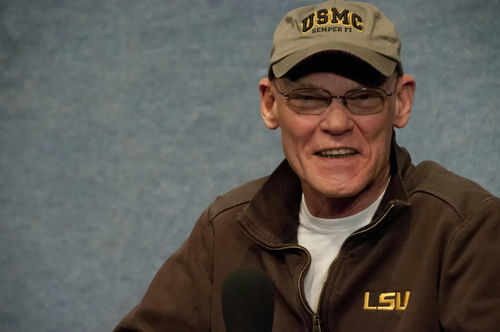 Man wearing a cap and a jacket smiling