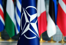 NATO flag in front of various national flags