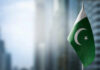 Flag of Pakistan waving in an urban setting