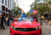 Unanswered Terror Question—Former Rep. Under Fire Participants in a pride parade with flags and a red convertible car