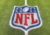 NFL Reporter Sidelined—Photos Spark INVESTIGATION NFL logo painted on a football field