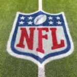 NFL logo painted on a football field