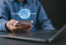 Person holding a smartphone with a voice recognition interface displayed