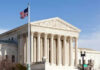 United States Supreme Court building with American flag
