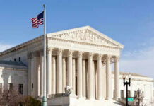 United States Supreme Court building with American flag