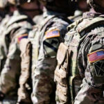 Surprise Move: Wartime Army Chief Ousted Abruptly Soldiers in camouflage with American flag patches standing
