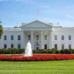 White House with fountain and flowers in front