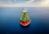 Oil tanker sailing straight through calm open sea