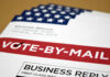 Vote-by-mail envelopes with U.S. flag design