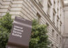 IRS building sign outside government building with greenery