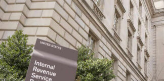 IRS building sign outside government building with greenery