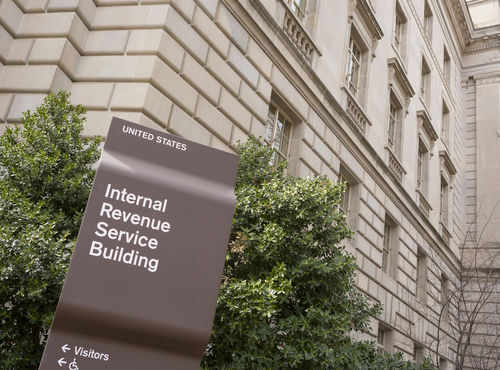 internal-revenue-service-irs395324794jpg IRS building sign outside government building with greenery