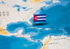 Subpoenas ROCK Activist World Over Cuba Ties A small Cuban flag placed on a map highlighting Cuba in the Caribbean