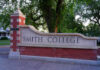 Entrance sign of Smith College surrounded by greenery