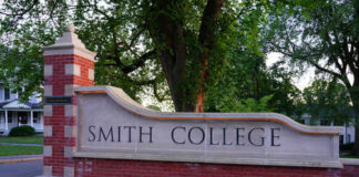 Entrance sign of Smith College surrounded by greenery
