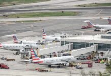 Customs Crackdown: Will Airports SHUT DOWN? Multiple American Eagle aircraft parked at an airport terminal with ground crew present