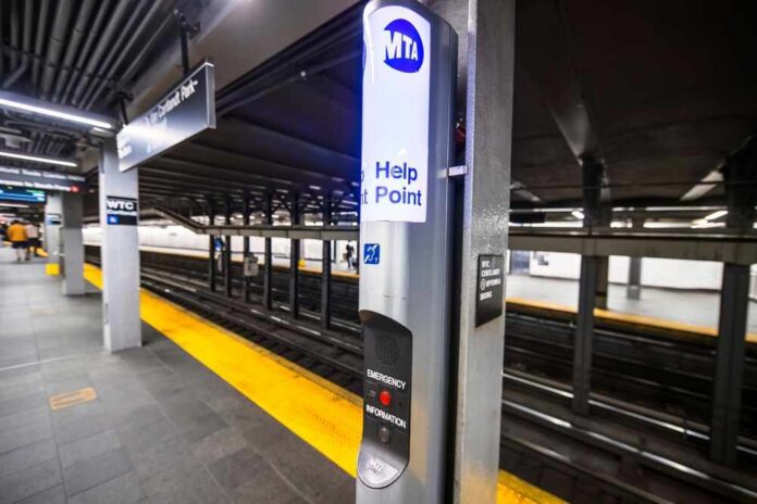 Help point sign at a subway station platform