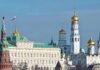 View of the Kremlin with golden domes and the Russian flag