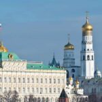 View of the Kremlin with golden domes and the Russian flag