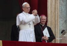 Pope giving a blessing from a balcony