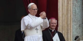Pope giving a blessing from a balcony