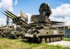 Tracked military surface-to-air missile launcher with radar