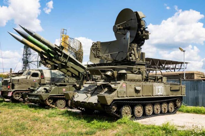 Tracked military surface-to-air missile launcher with radar