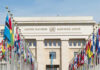 United Nations building with rows of world flags