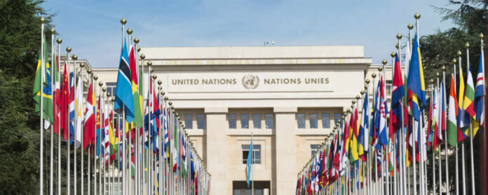 United Nations building with rows of world flags