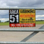 Area 51 warning sign on metal fence