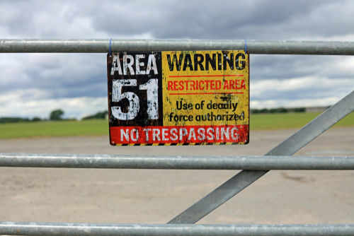 Area 51 warning sign on metal fence